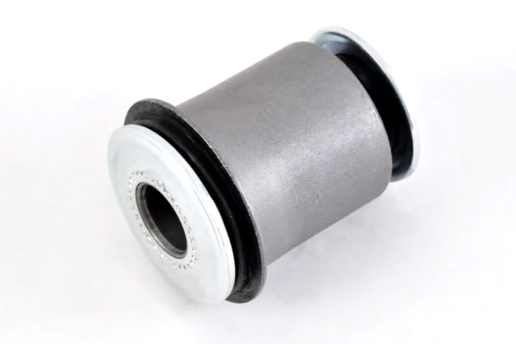 This image shows a control arm bushing on a white background representing the concept of control arm vs bushing replacement