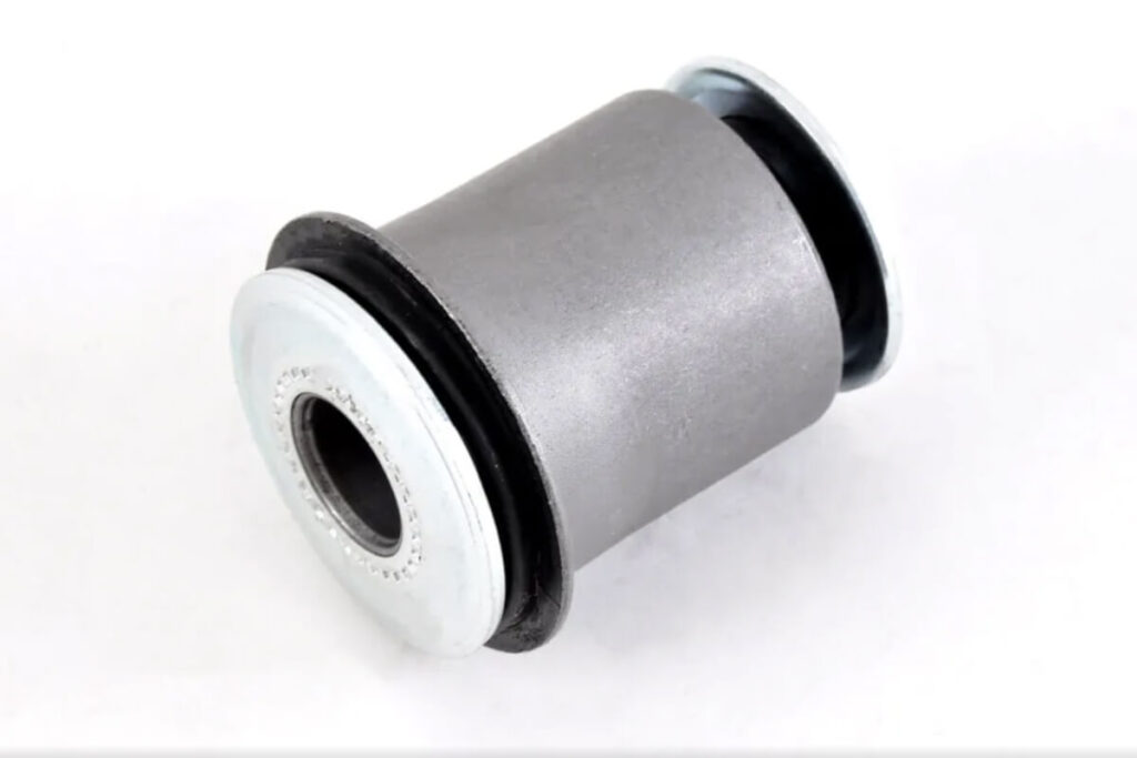 This image shows a control arm bushing on a white background representing the concept of Rubber vs Polyurethane Bushings
